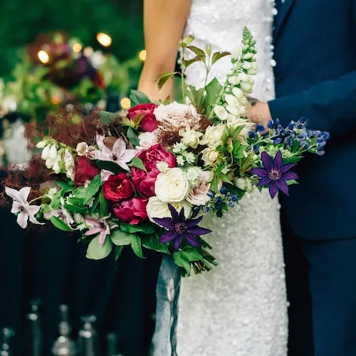 Bride and Groom with bespoke wedding bouquet