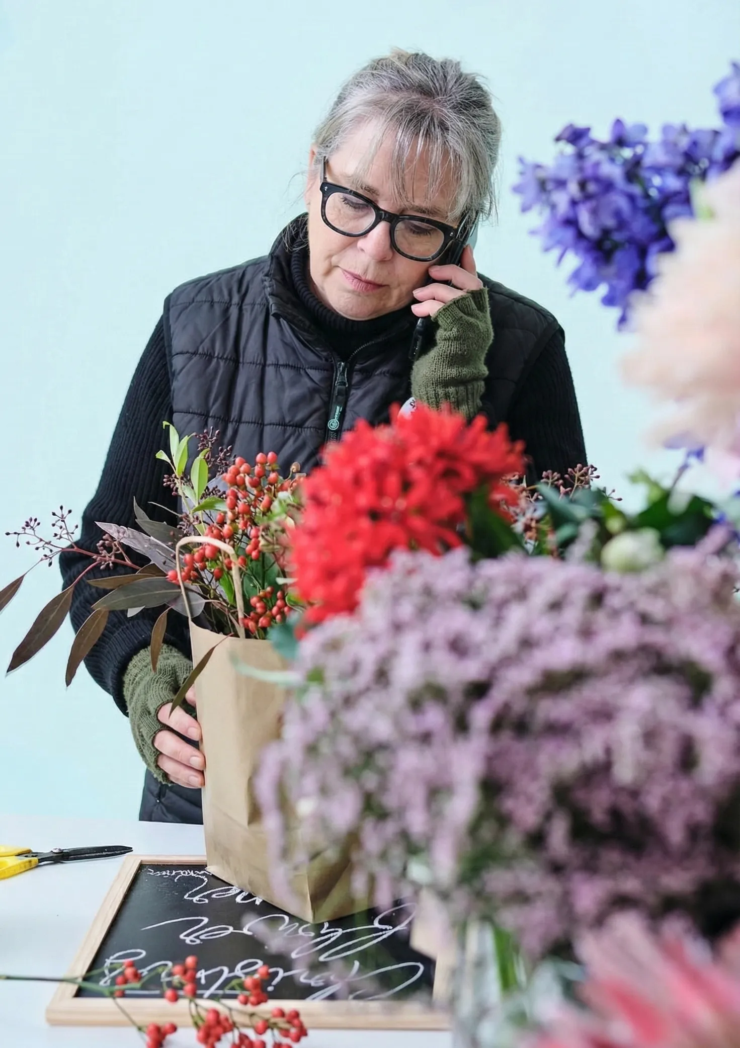 Phyllis creating bespoke wedding bouquet at PJ's Petals Dumfries florist