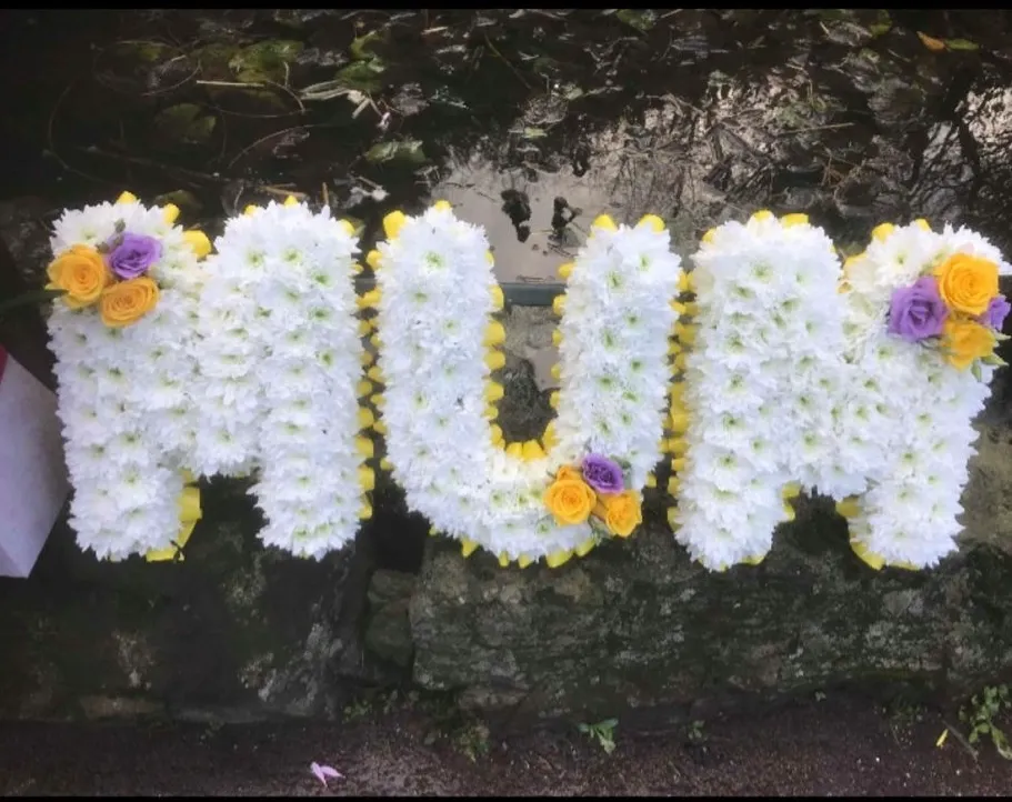 Floral lettering name tribute for a funeral in Dumfries